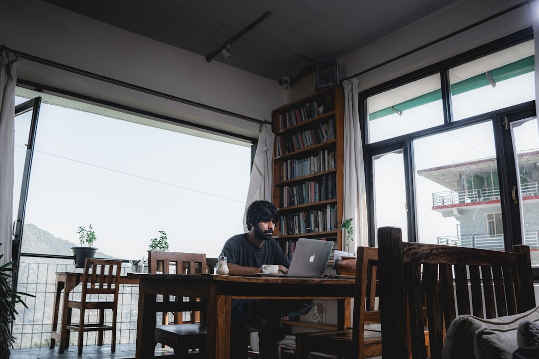 person reading book in cafe