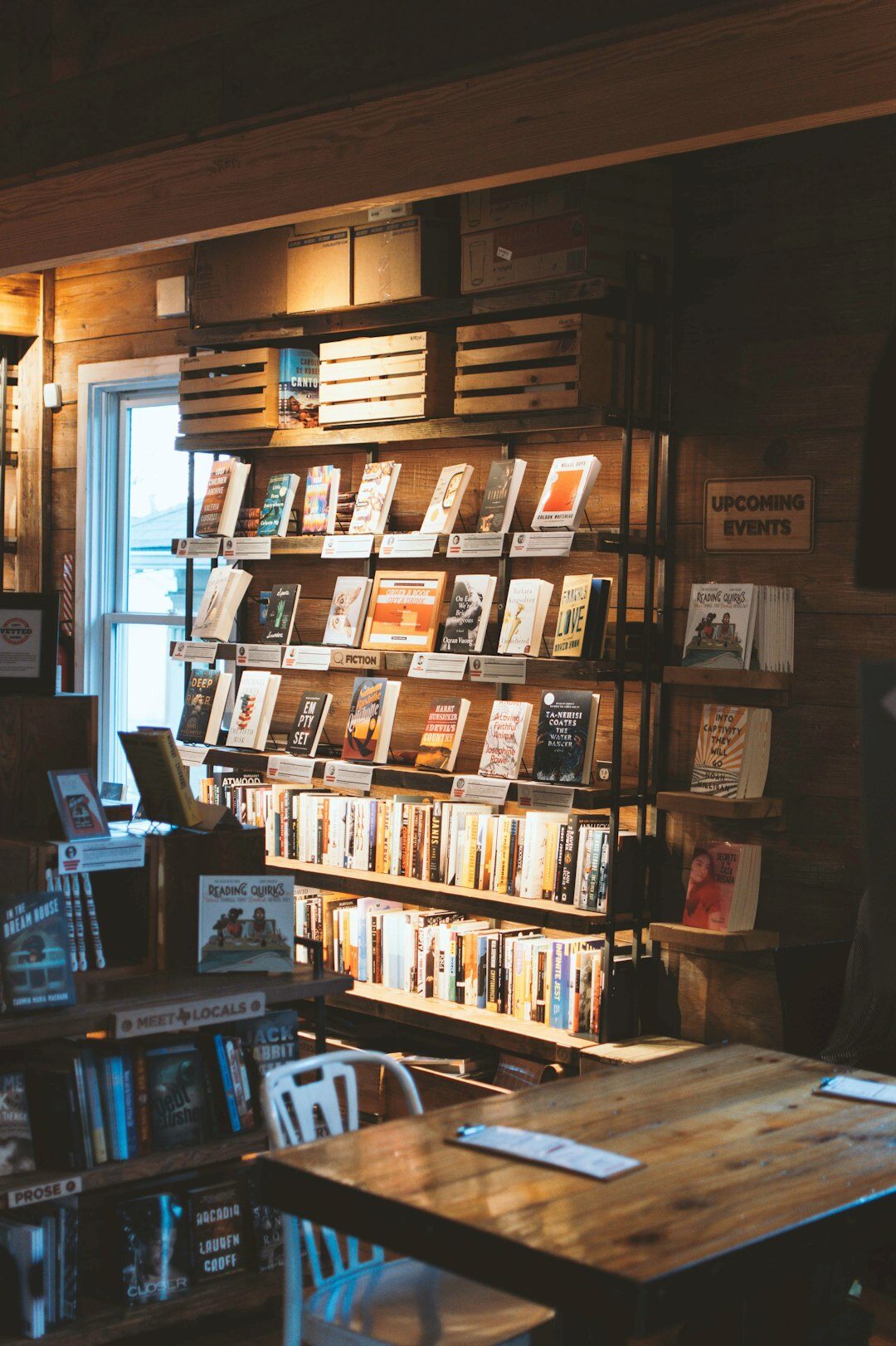 Cozy independent bookstore interior with shelves full of crime and detective novels